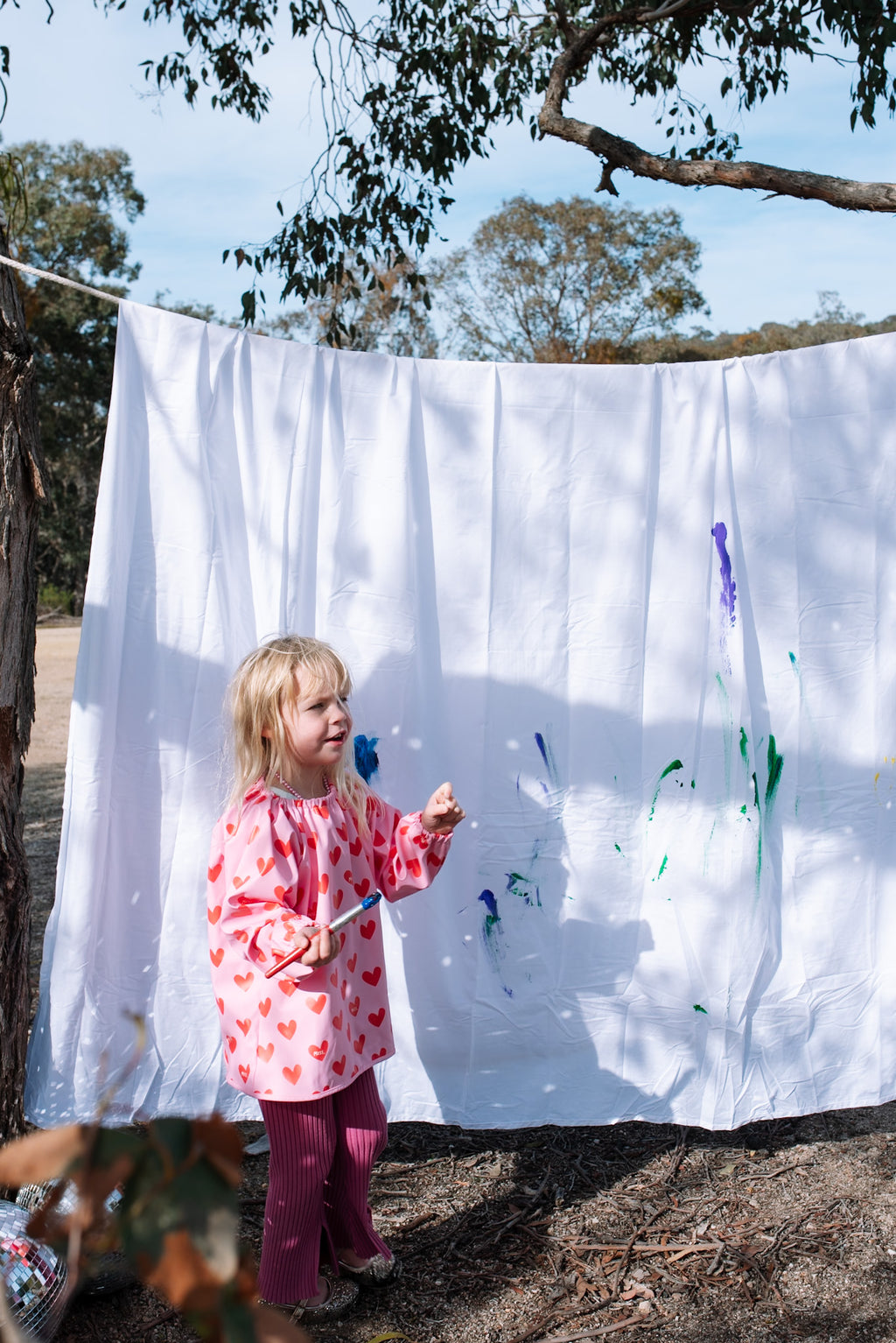 Kids wearing Waterproof Kids Art Smock and Food Bib during messy playgroup art and sensory play session