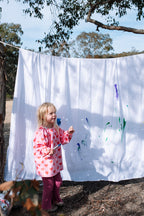 Kids wearing Waterproof Kids Art Smock and Food Bib during messy playgroup art and sensory play session