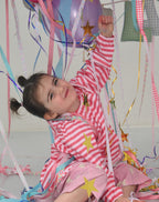 Child wearing Sherbet waterproof art smock during messy play